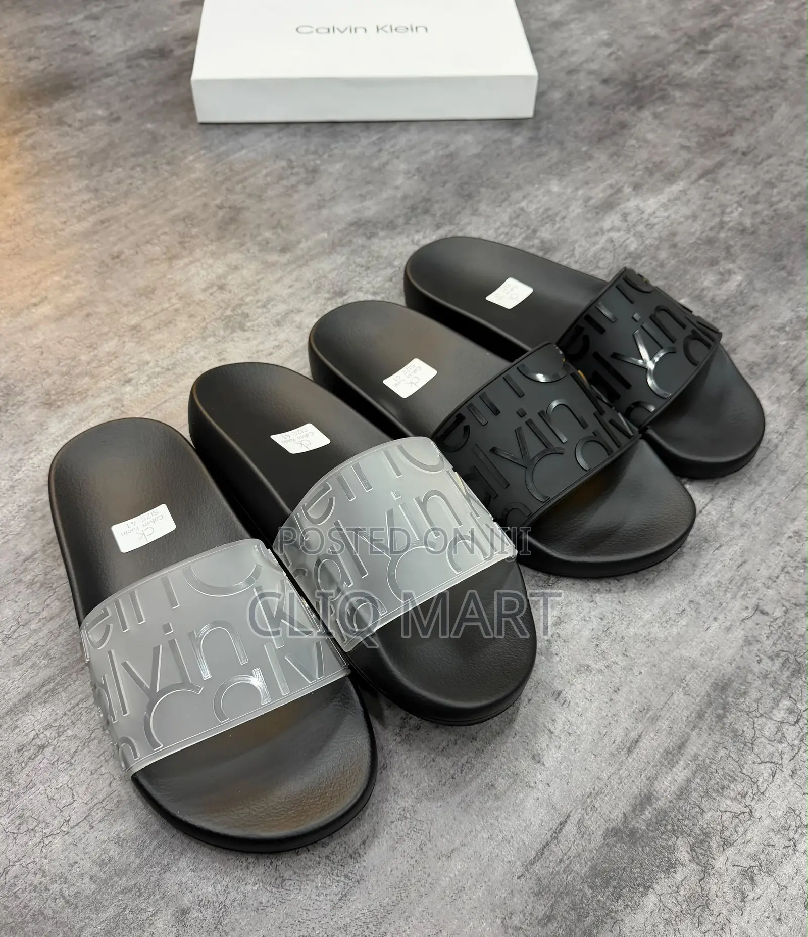 Calvin Klein Embossed Logo Slider Sandals | Black & Transparent