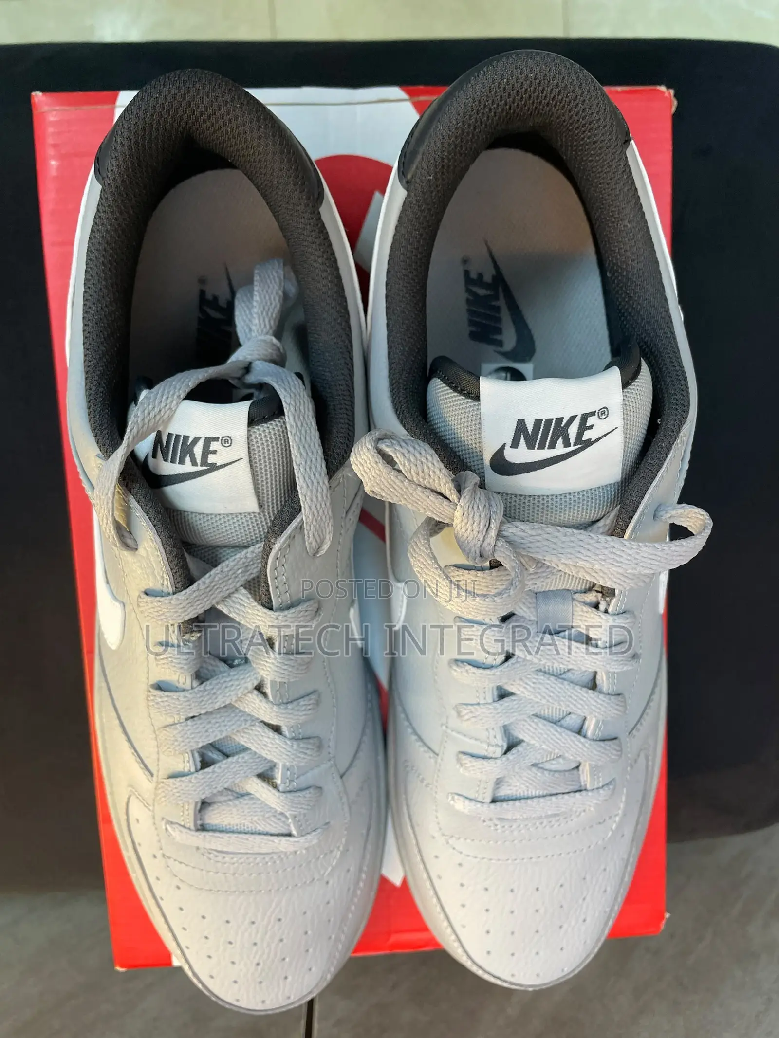 Nike Men’s Dunk Low Embossed Big Logo Sneaker