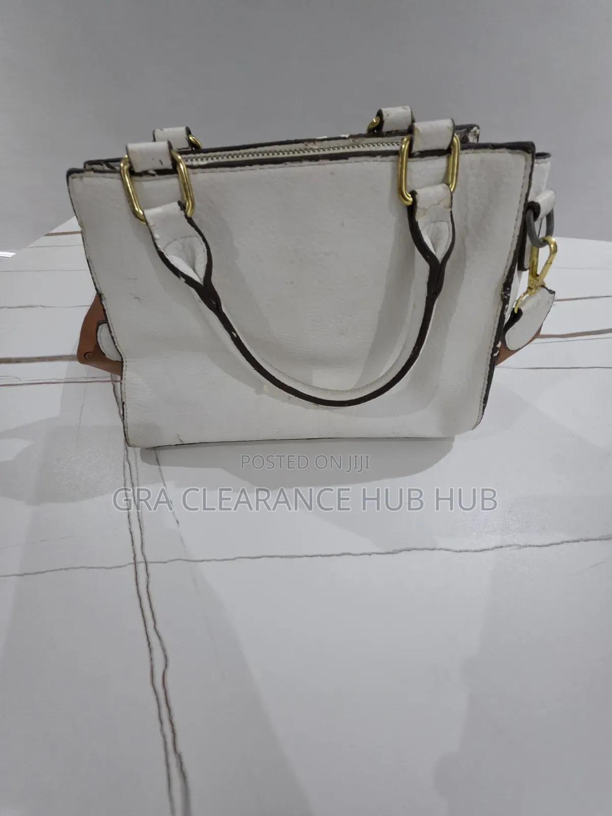 White Pebbled Top Handle Satchel With Branded Web Strap