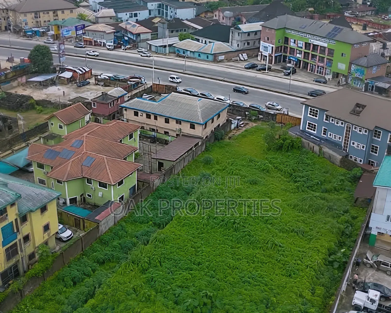Fenced 5 Plots of Commercial Land on the Busy Ada George Road