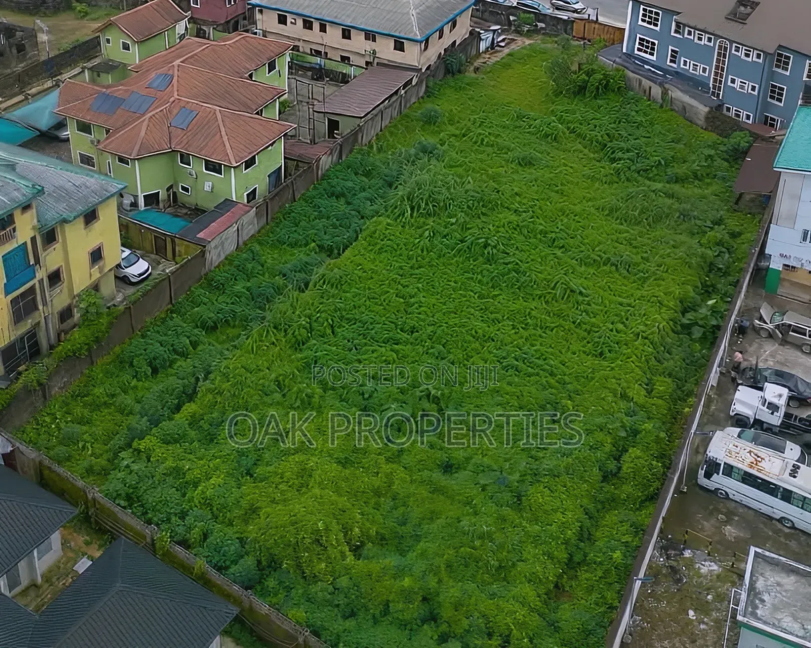 Fenced 5 Plots of Commercial Land on the Busy Ada George Road