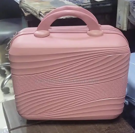 A Mini Hard-Shell Cosmetic, Vanity, or Children's Travel Case Featurin