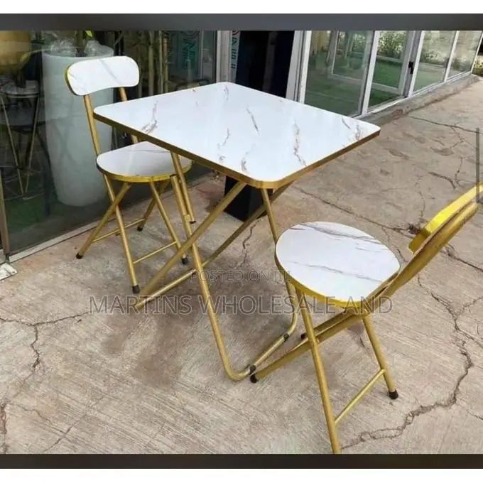 A Marble-Design Foldable Table and Chair Set Featuring a White Faux-M