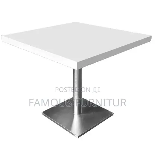 Modern Round Pedestal Restaurant Table With a White Top Square Base.