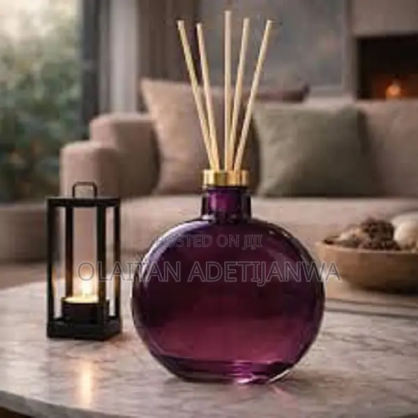 Scented Reed Diffuser With a Gold-Toned Cap.