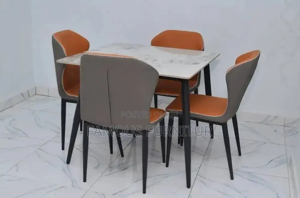 Square White Top Dining Table With Black Metal Legs.