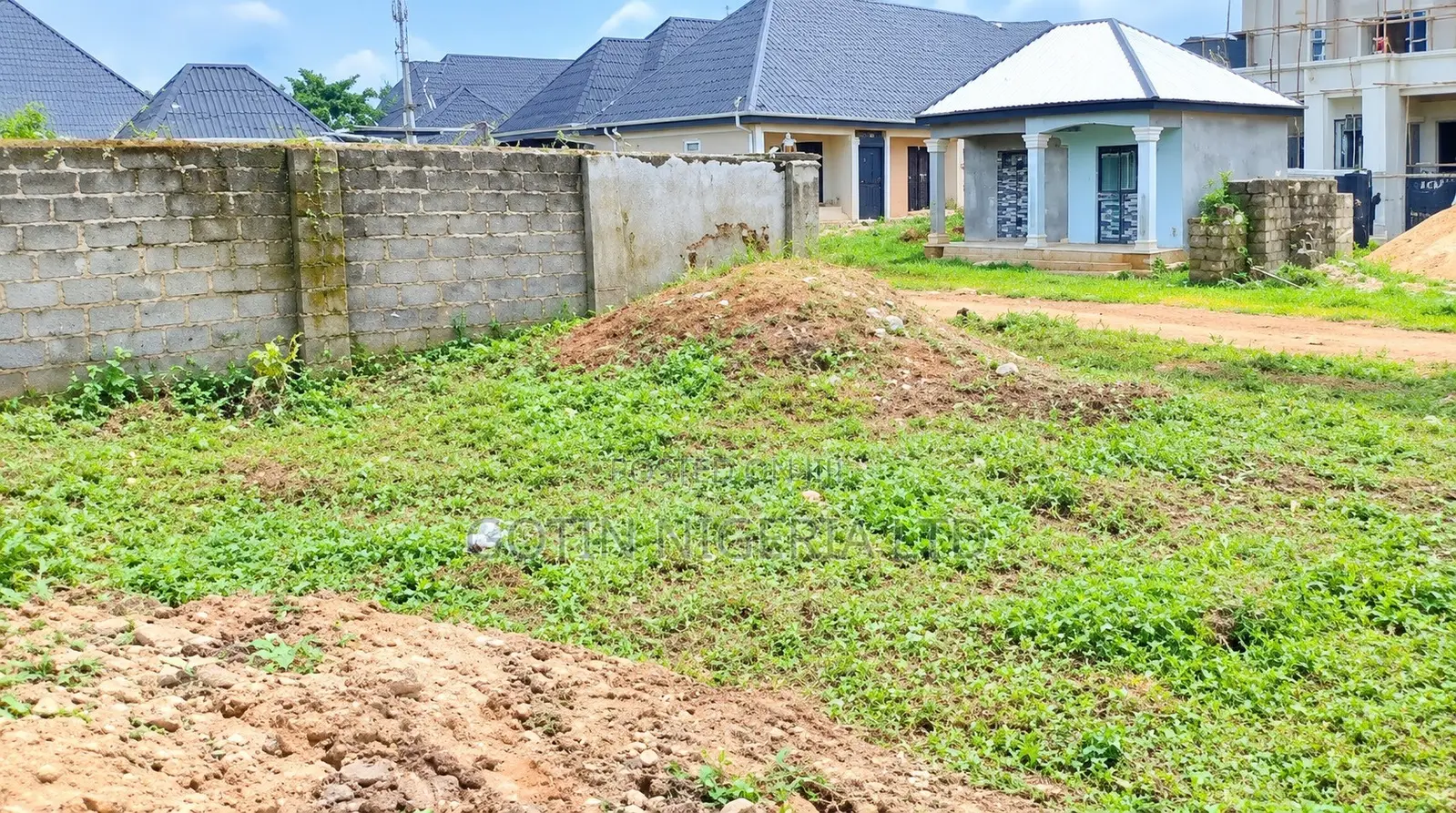 50ft × 100ft Plot of Land With Existing 4-Bedroom Bungalow Foundation