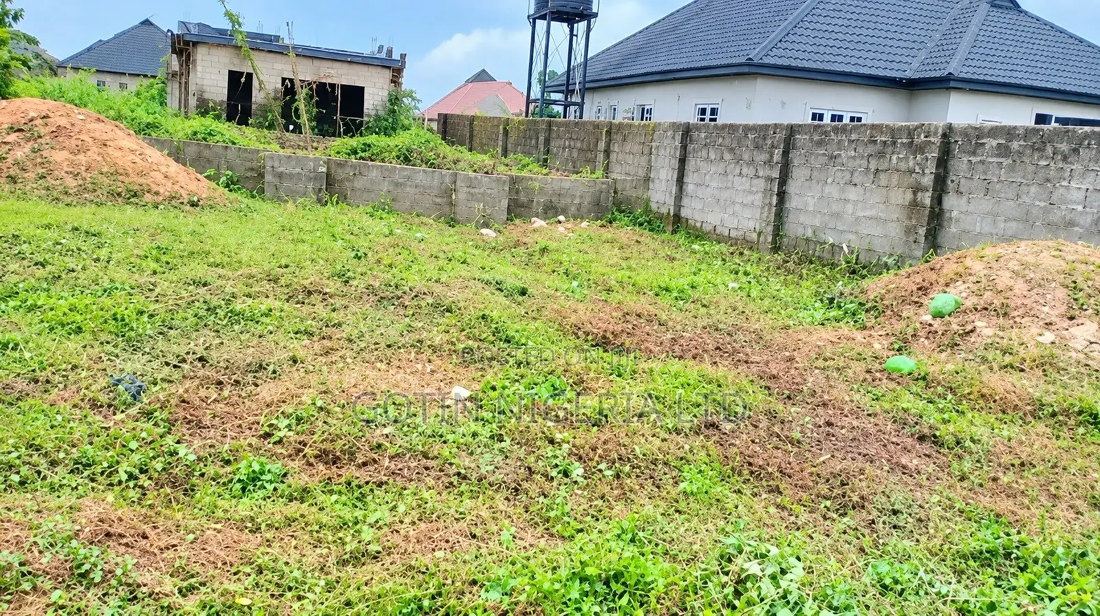 50ft × 100ft Plot of Land With Existing 4-Bedroom Bungalow Foundation