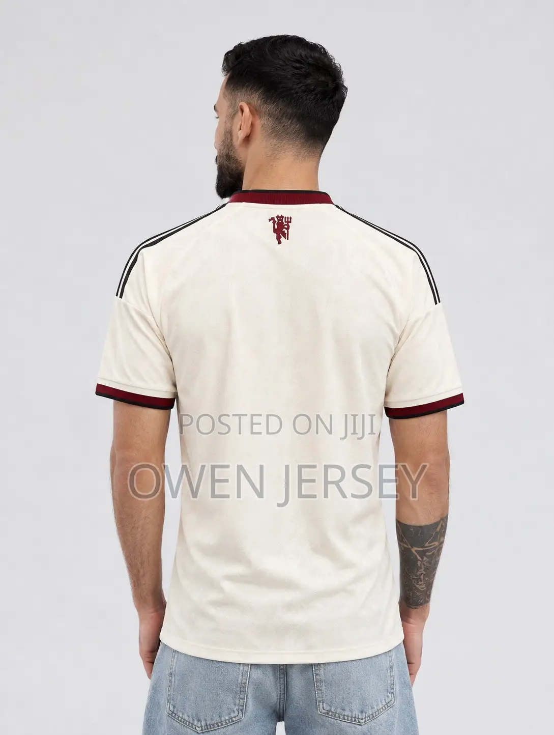 Manchester United Cream Jersey – Burgundy Edition.