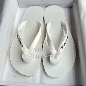 Christian Louboutin Minimalist Logo Flip-Flops | Luxury Resortwear