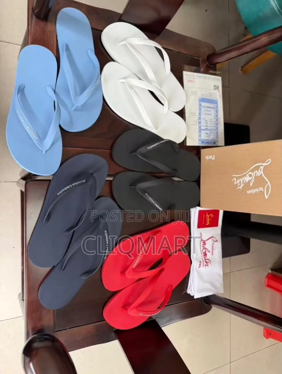 Christian Louboutin Minimalist Logo Flip-Flops | Luxury Resortwear