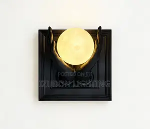 Luxury Black Sculptural Wall Sconce With a Warm