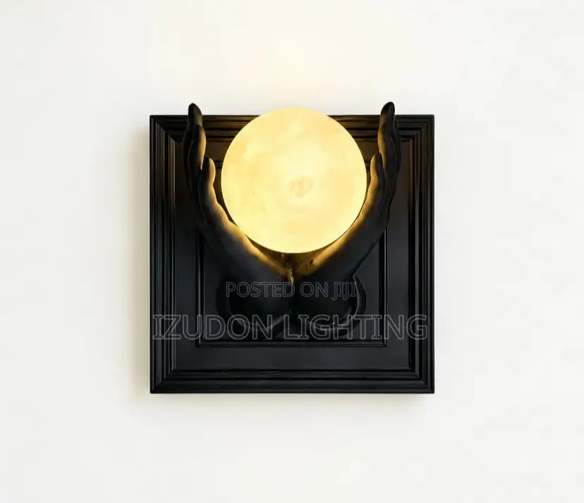 Luxury Black Sculptural Wall Sconce With a Warm