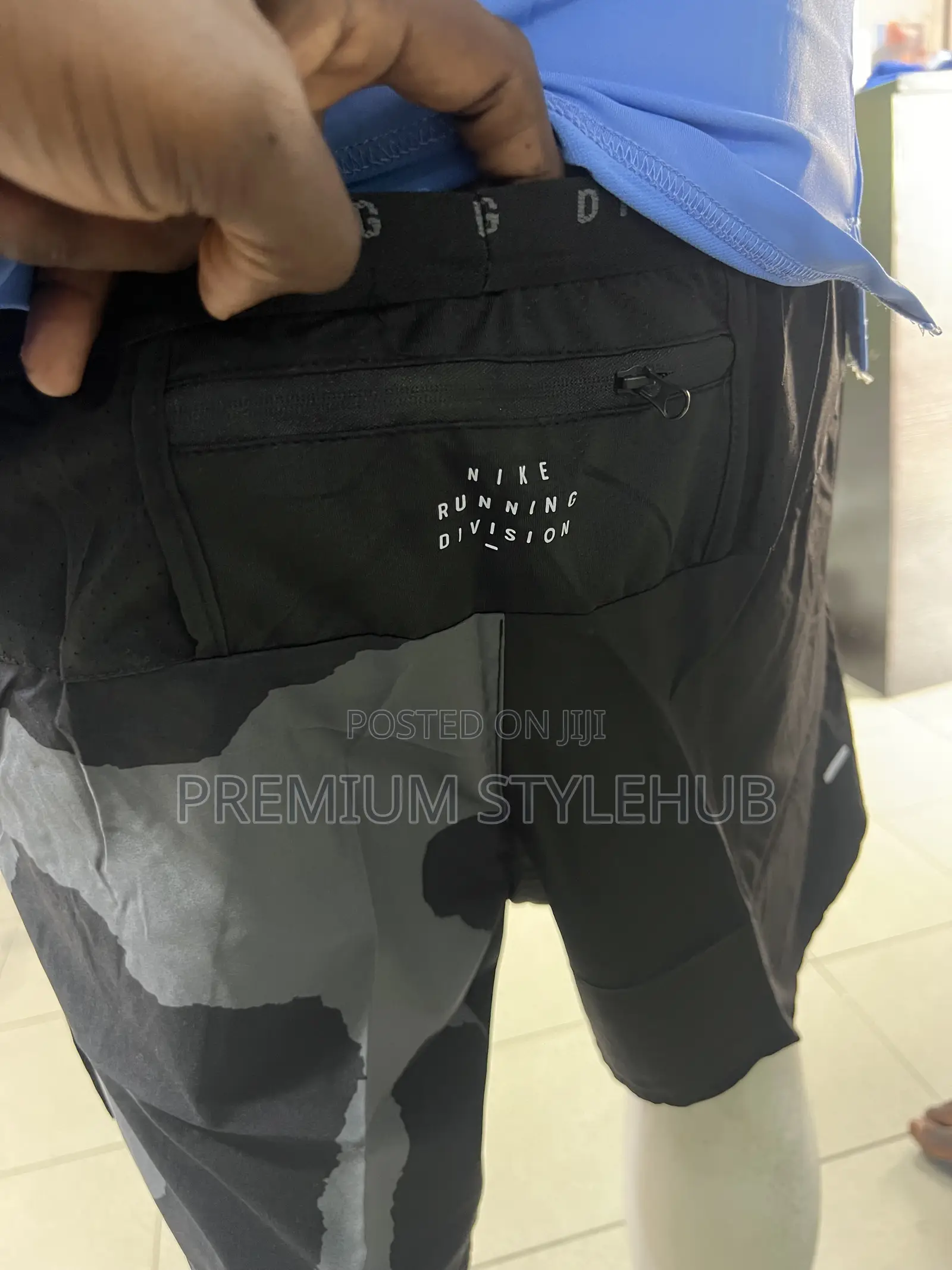 Blue Nike Shirt & Black Camo Shorts