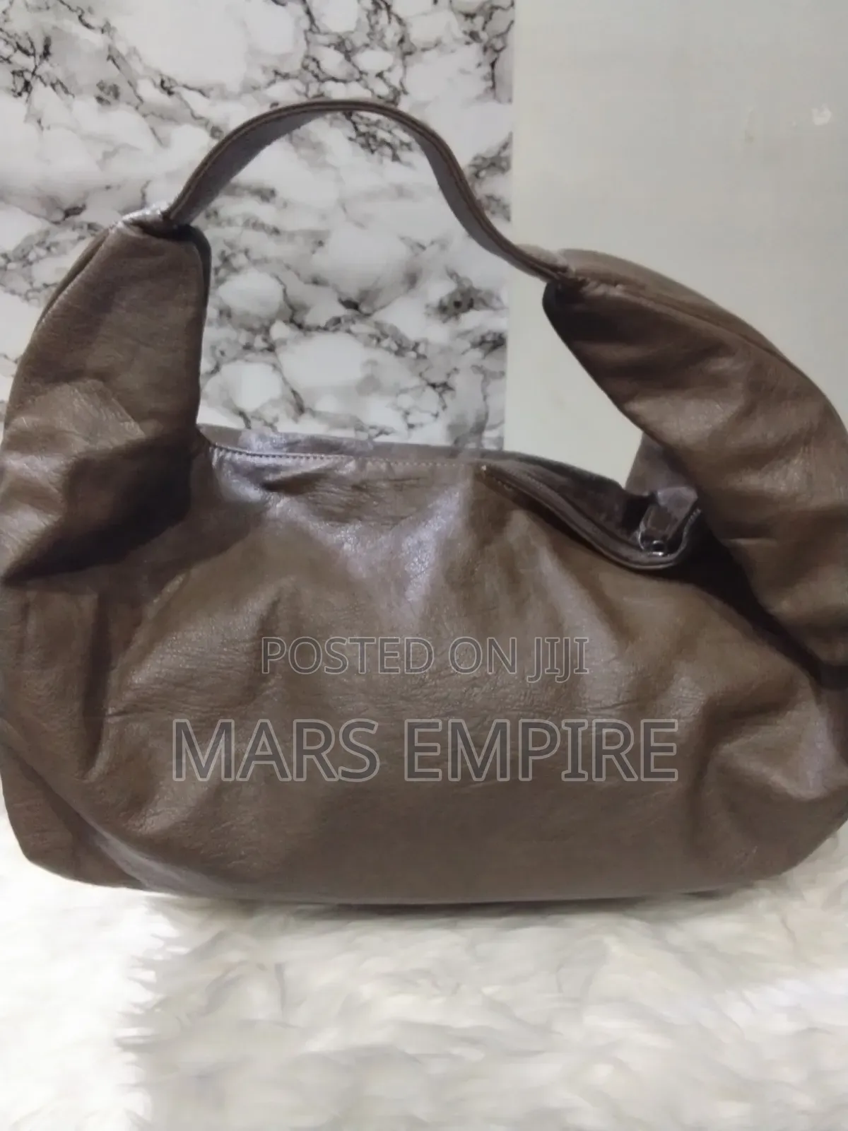 Brown Leather Travel Bag - N18,000. -Lugbe Abuja