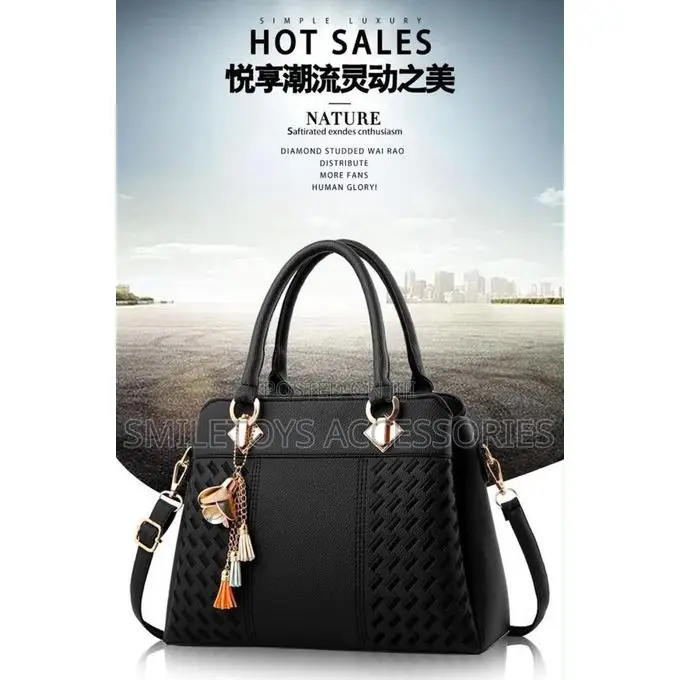 Textured Ladies Handbag With Flower Charm & Strap