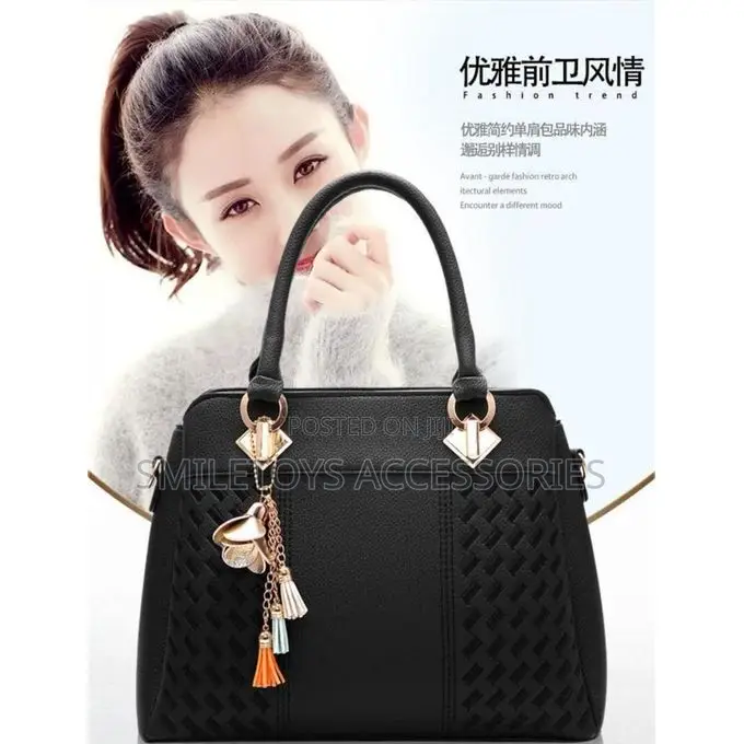 Textured Ladies Handbag With Flower Charm & Strap