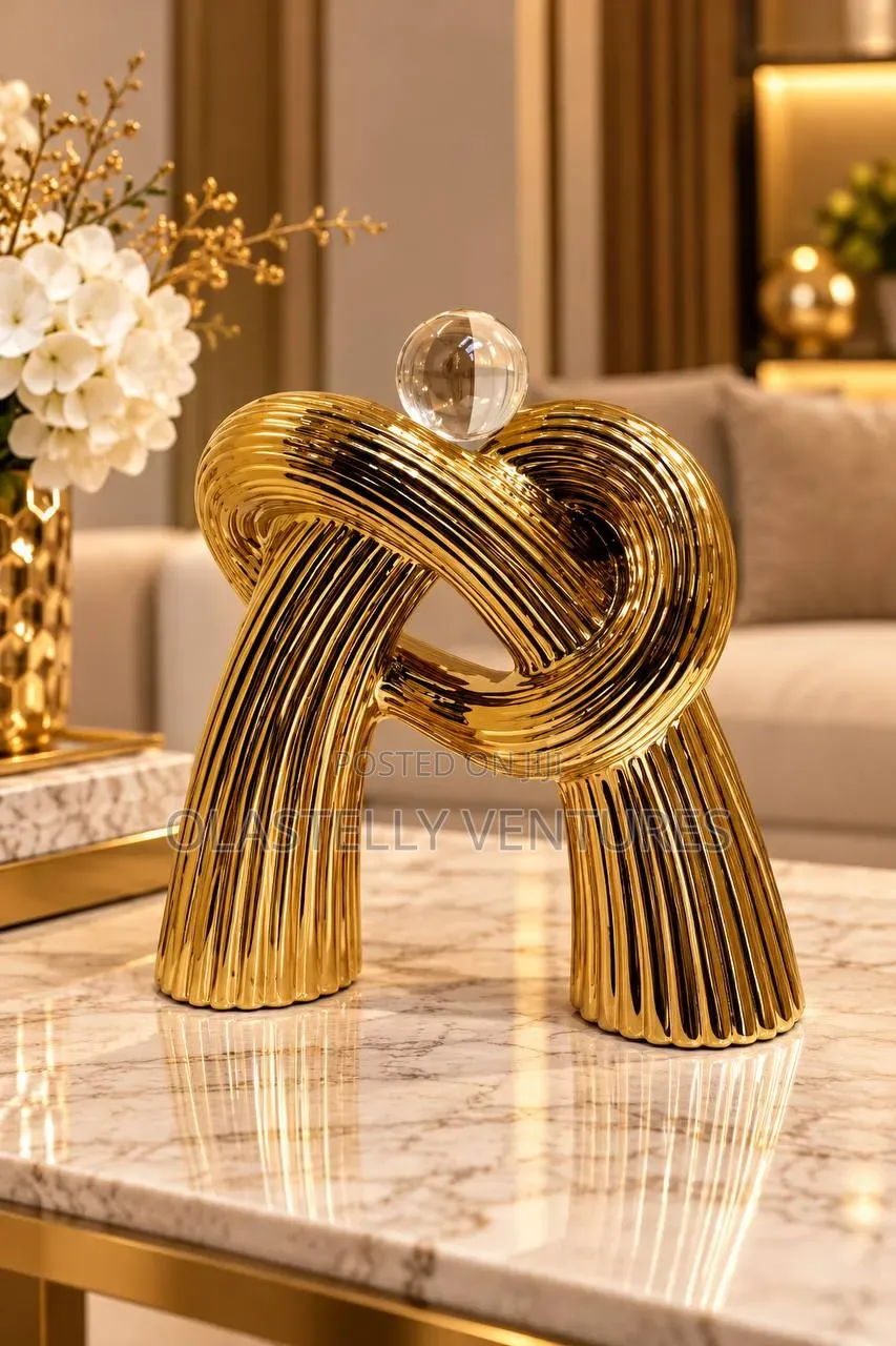 Gold Ribbed Knot Decor
Tem