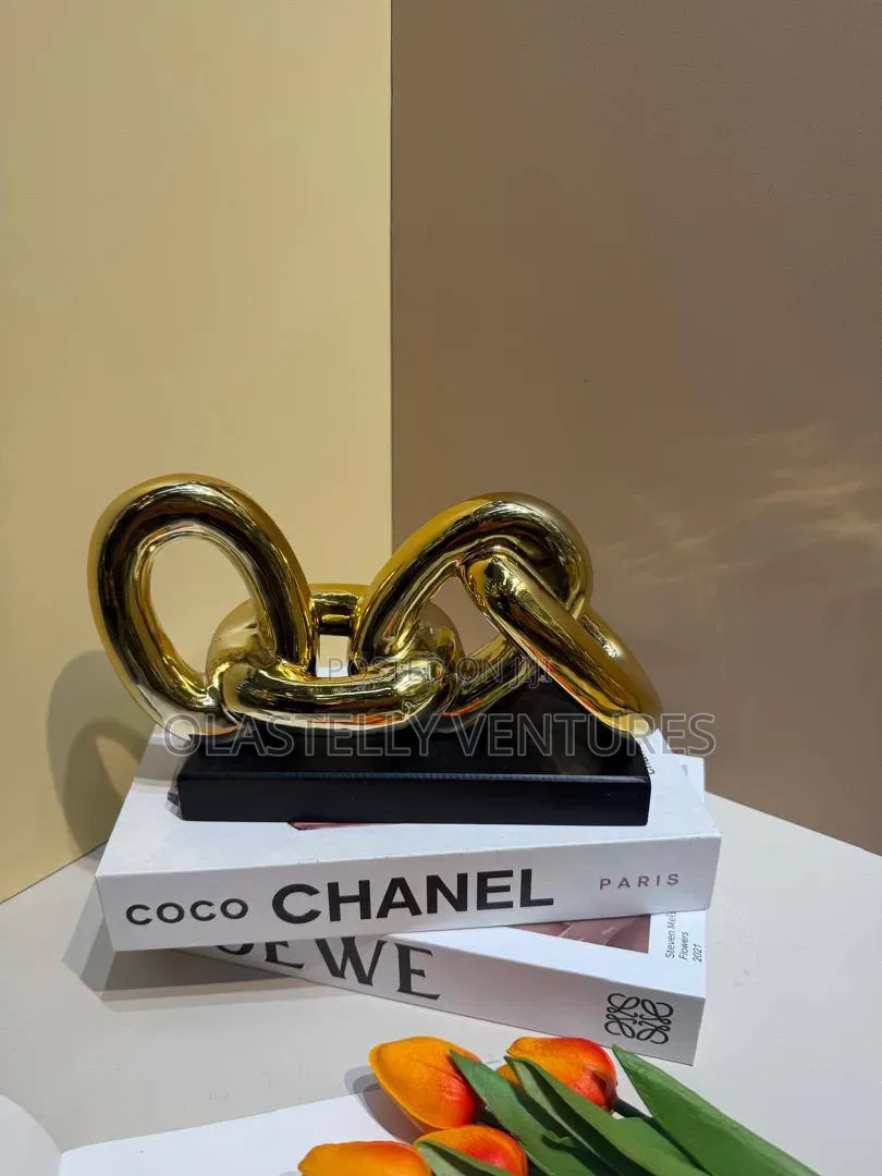 Gold Ribbed Knot Decor
Tem