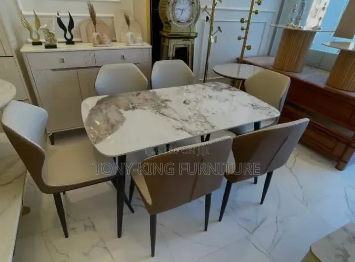 A Modern 6-Seater Marble Top Dining Set With Six Cushioned Chairs
