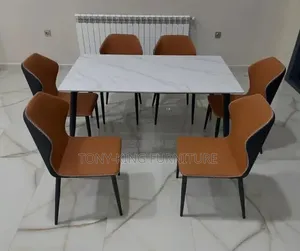 A Modern 6-Seater Marble-Top Dining Table Set a White Marbletop