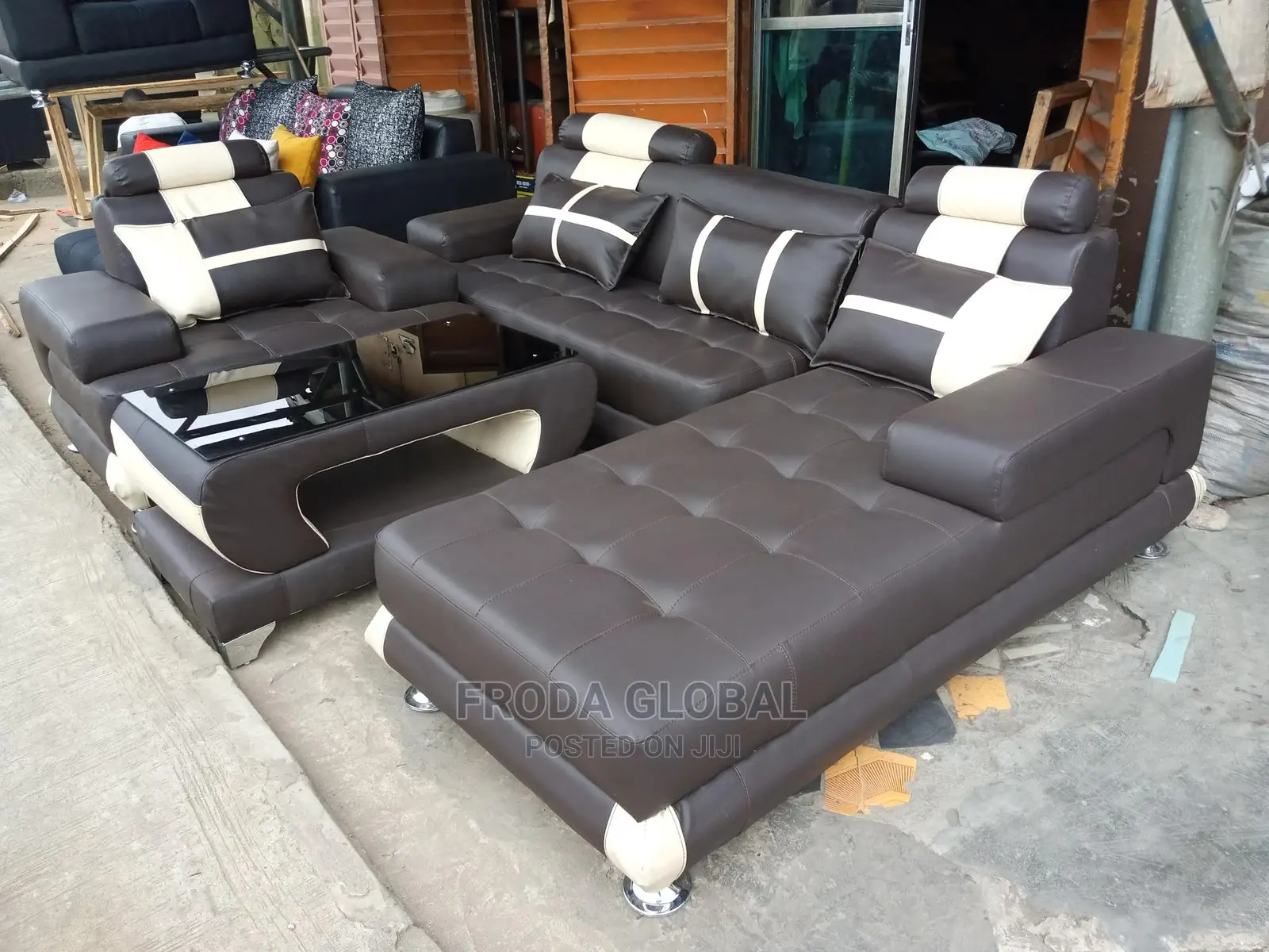 L-Shaped Sofa With a Single Seater Chair and Table