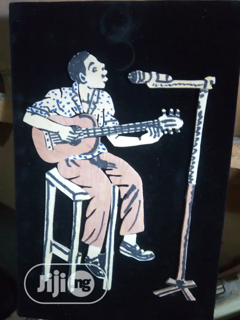 Handmade Artwork Of An African Musician Playing Guitar