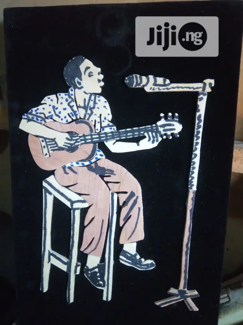 Handmade Artwork Of An African Musician Playing Guitar