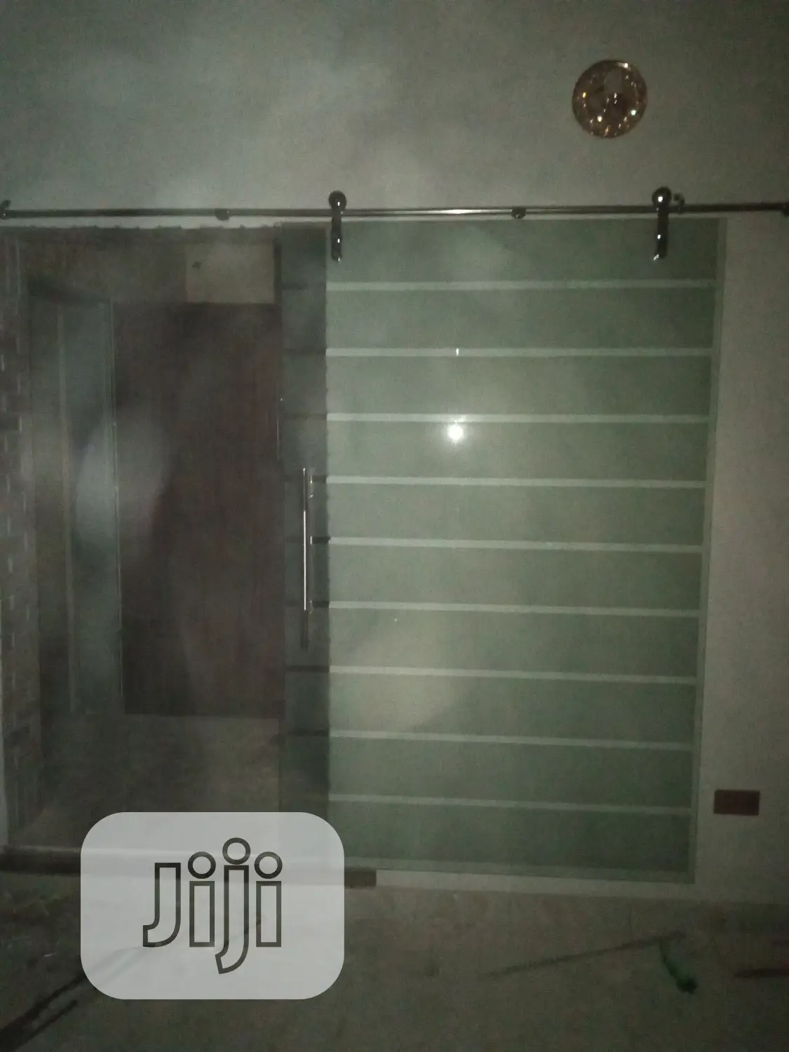 Glass Door Between Waiting Room/ Living Room.