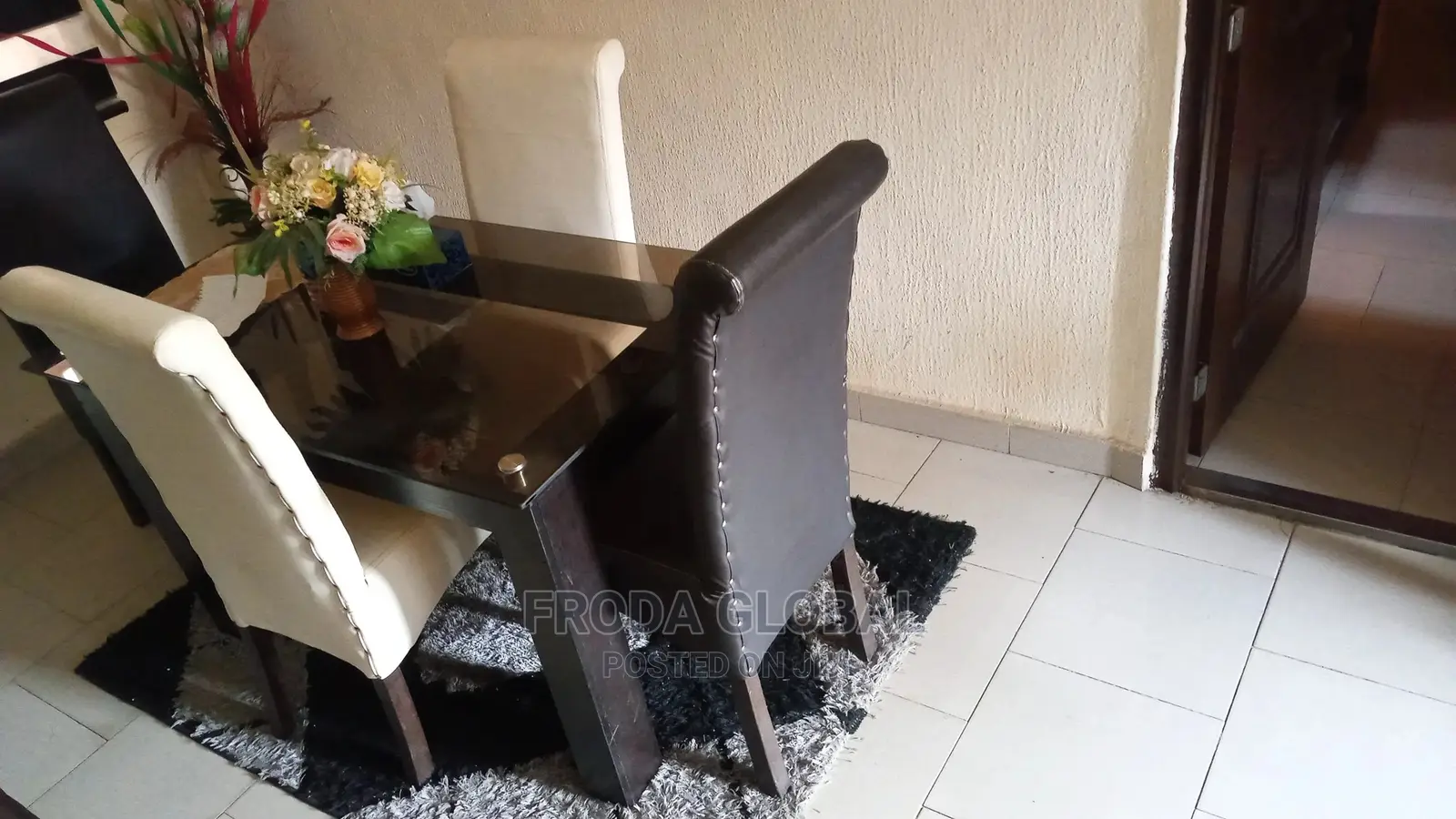 Dining Set of 4 Chairs and a Glass Table. Leather