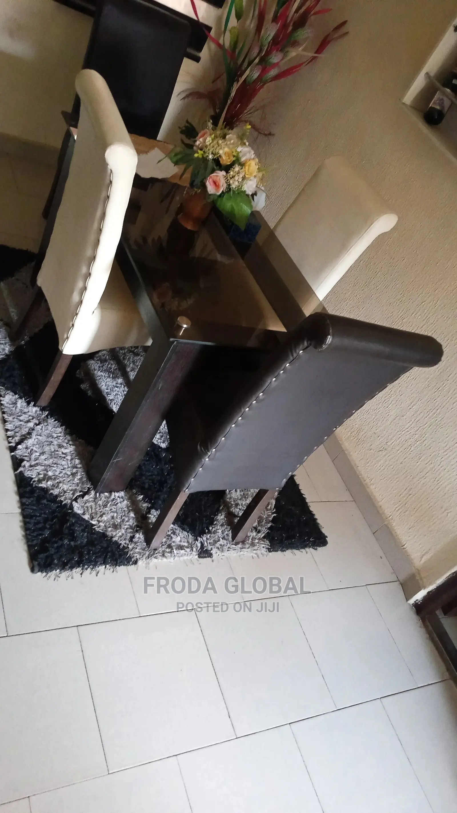 Dining Set of 4 Chairs and a Glass Table. Leather