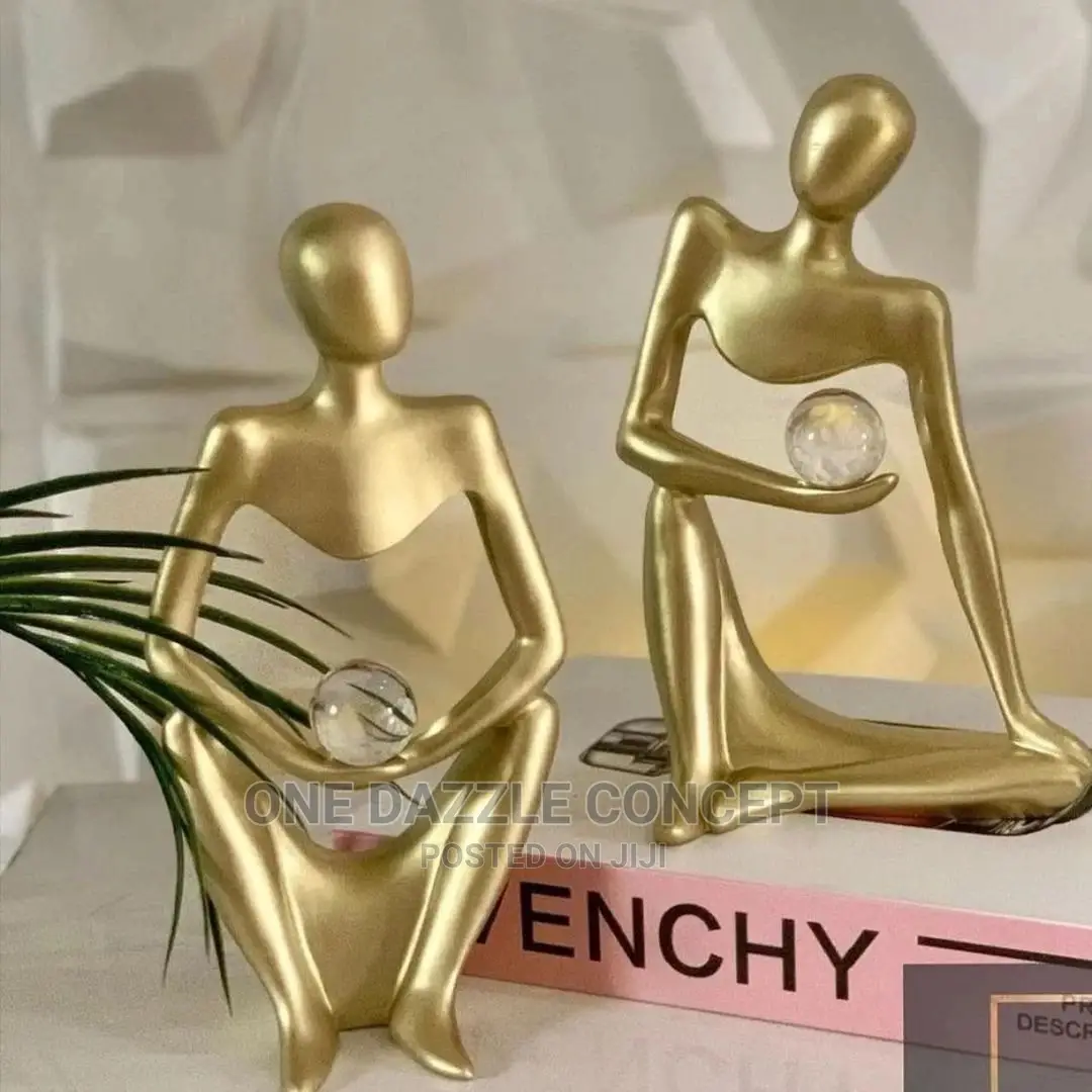 Gold Figurine With Crystal
