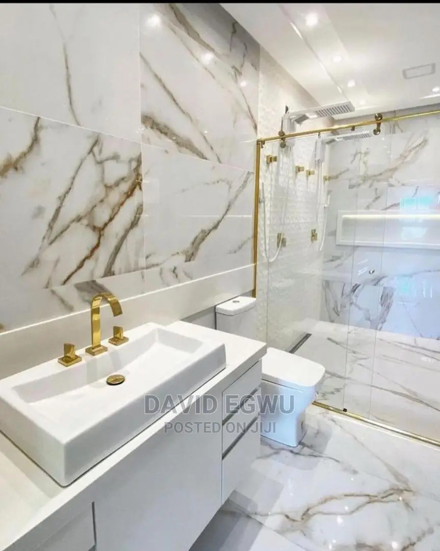 Shower Cubicle With Golden Accessories