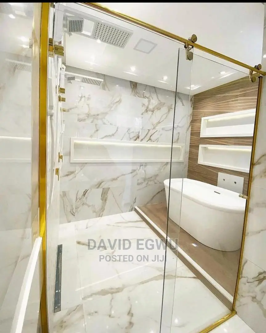 Shower Cubicle With Golden Accessories