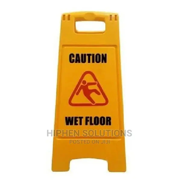 Caution Wet Floor and Blurred Cleaner