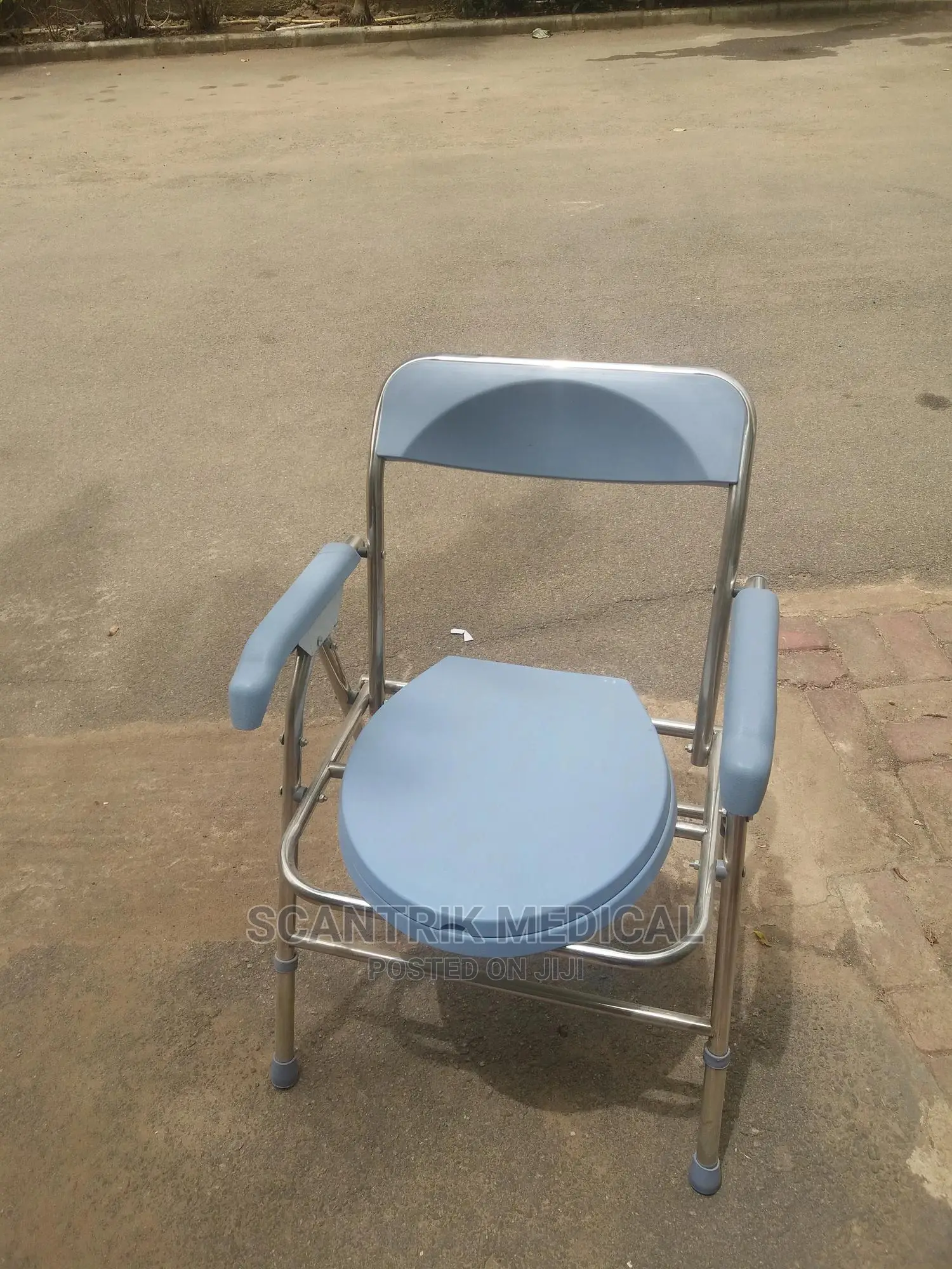 Commode Chair With Padded Mobile Over Pregnant Toilet Seat