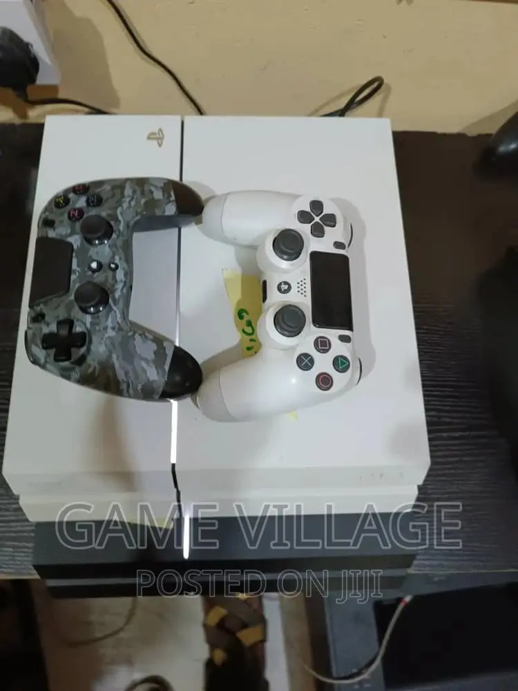 Fairly Used Playstation 4 Console With Games Accessories