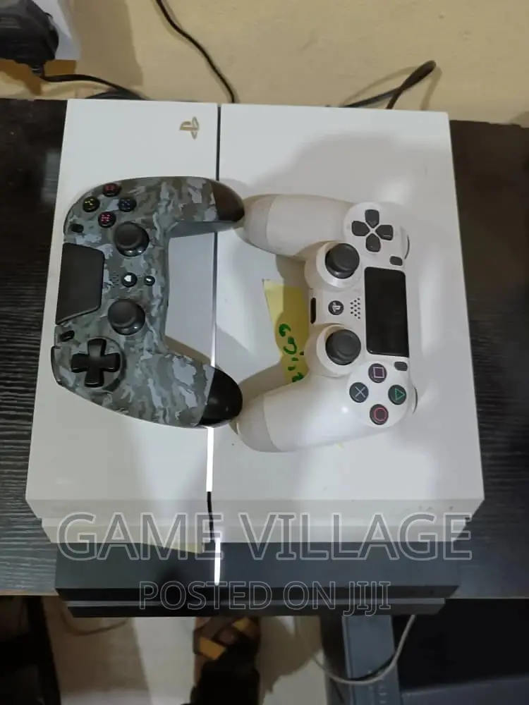 Fairly Used Playstation 4 Console With Games Accessories