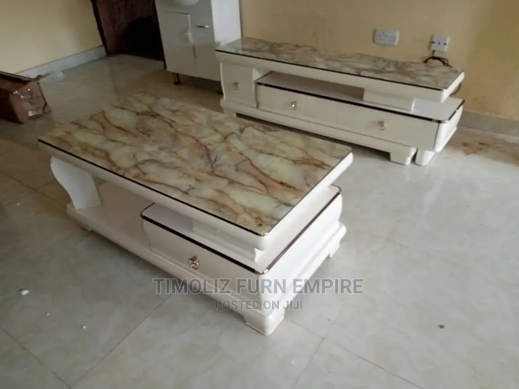 Adjustable Tv Stand With Its Tableand Several Storage Spaces
